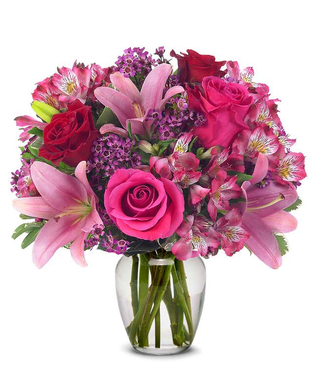 Pink asiatic lilies, pink roses and red roses