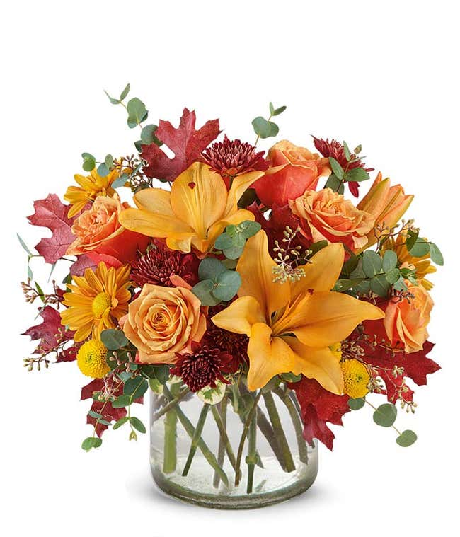 Tall fall bouquet with orange lilies, orange roses and orange daisies